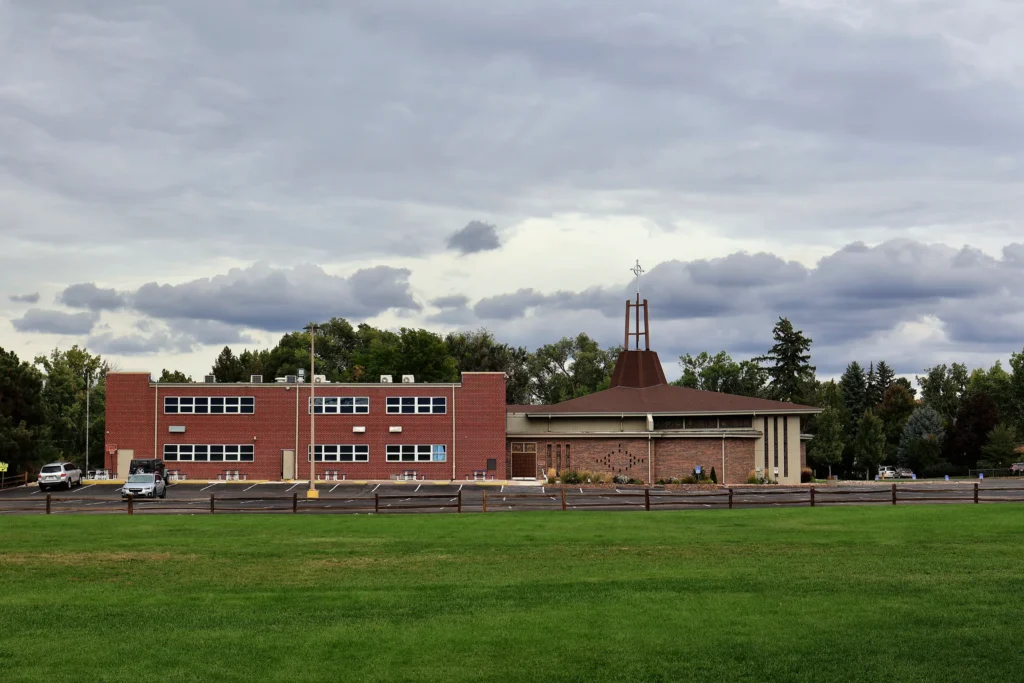 The Hand in Hand ABA building and neighboring church across the grass field on Larkspur Dr