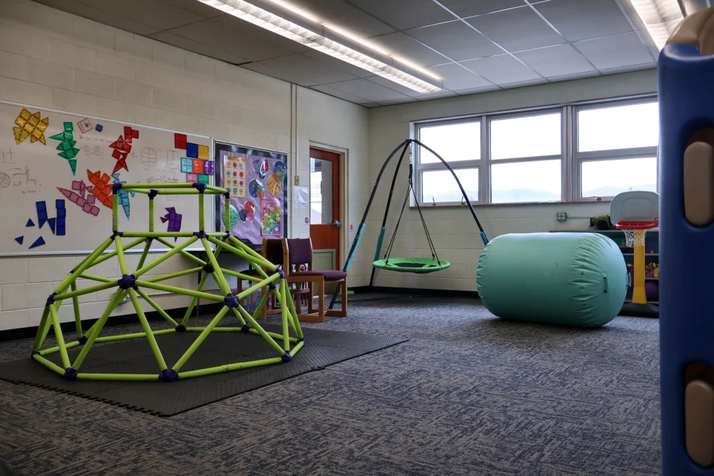 Swing corner with mats and therapy balls in the Hand in Hand ABA motor room